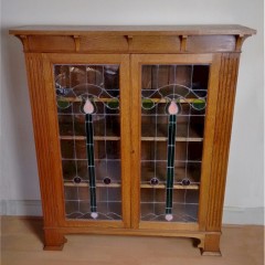 Larger arts and crafts bookcase , leaded glass