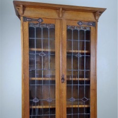 Arts and crafts oak bookcase with strap hinges