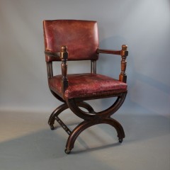 Victorian X framed mahogany and leather chair