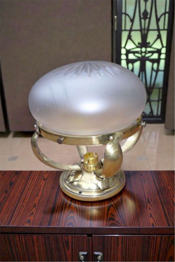 Small domed ceiling light in hammered brass