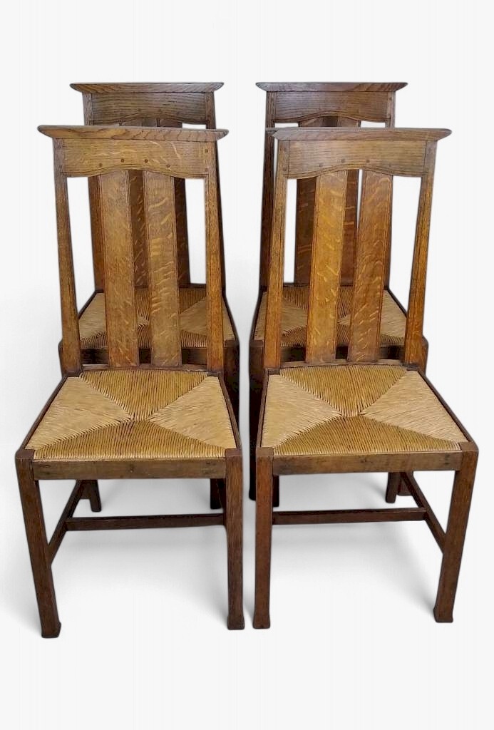  Arts and crafts oak dining chairs by Liberty