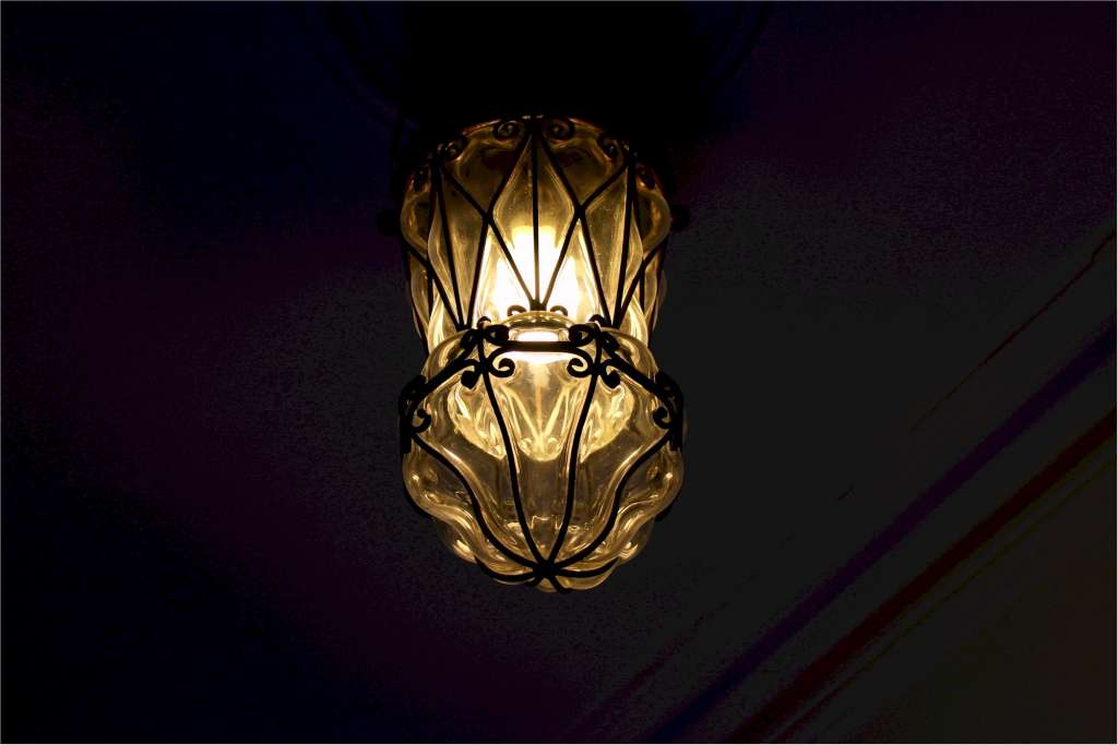 Copper lantern with clear blown glass
