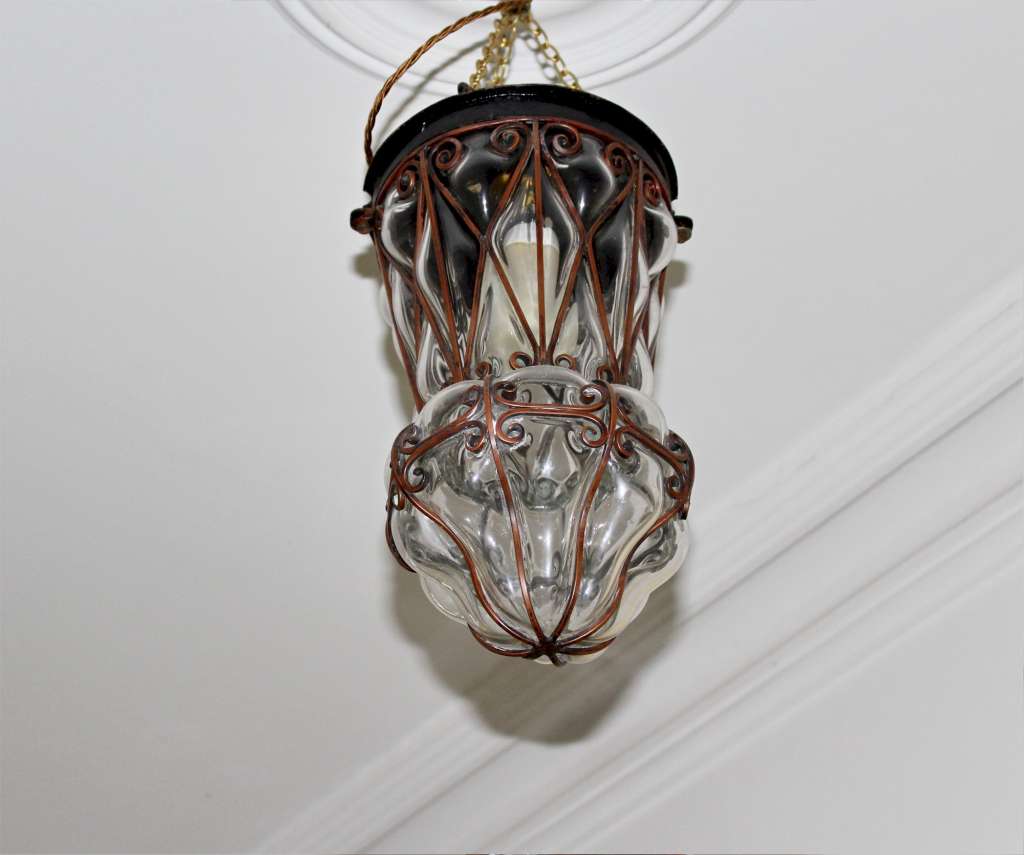 Copper lantern with clear blown glass