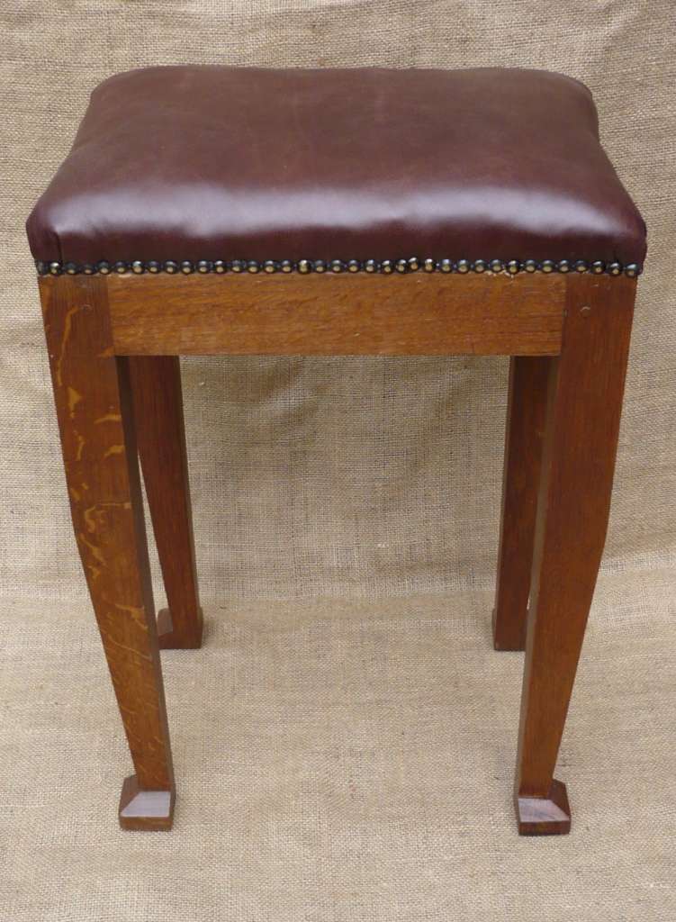 Leather topped stool in oak