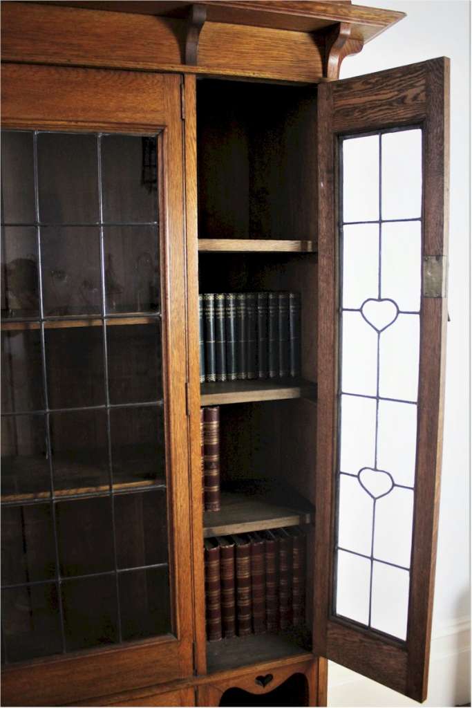 Arts and Crafts glazed bookcase with hearts