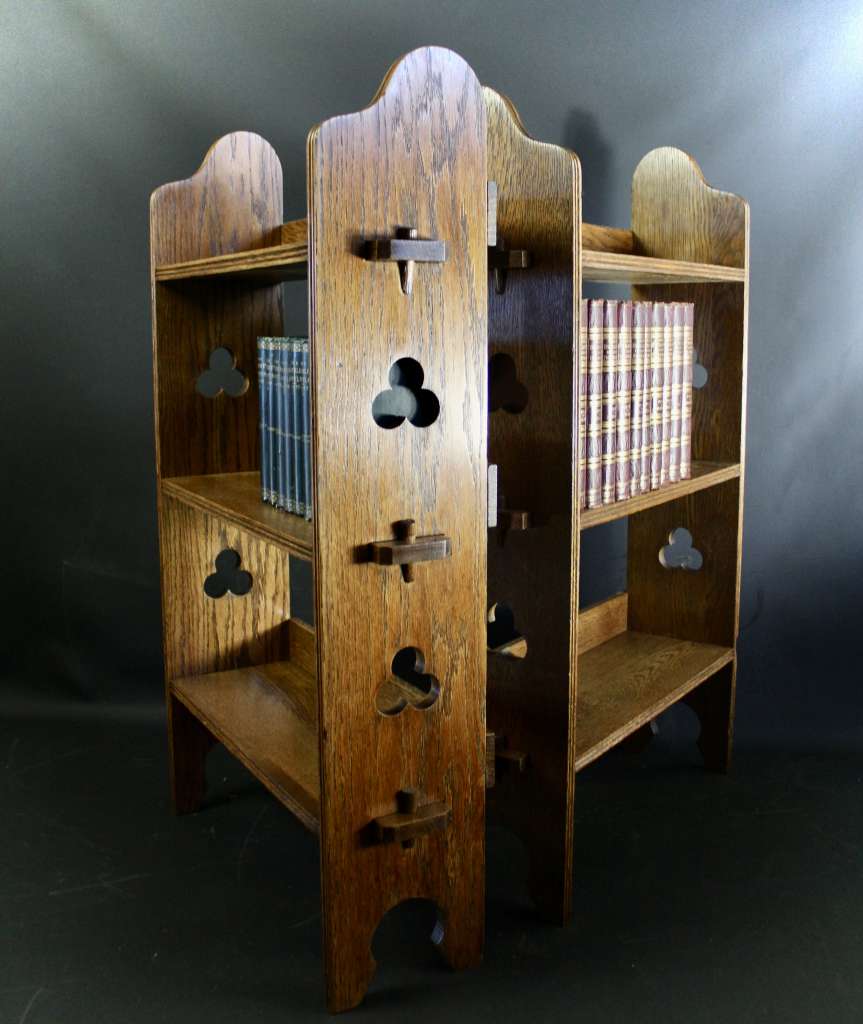 A Pair of Arts and Crafts oak open bookshelves, 