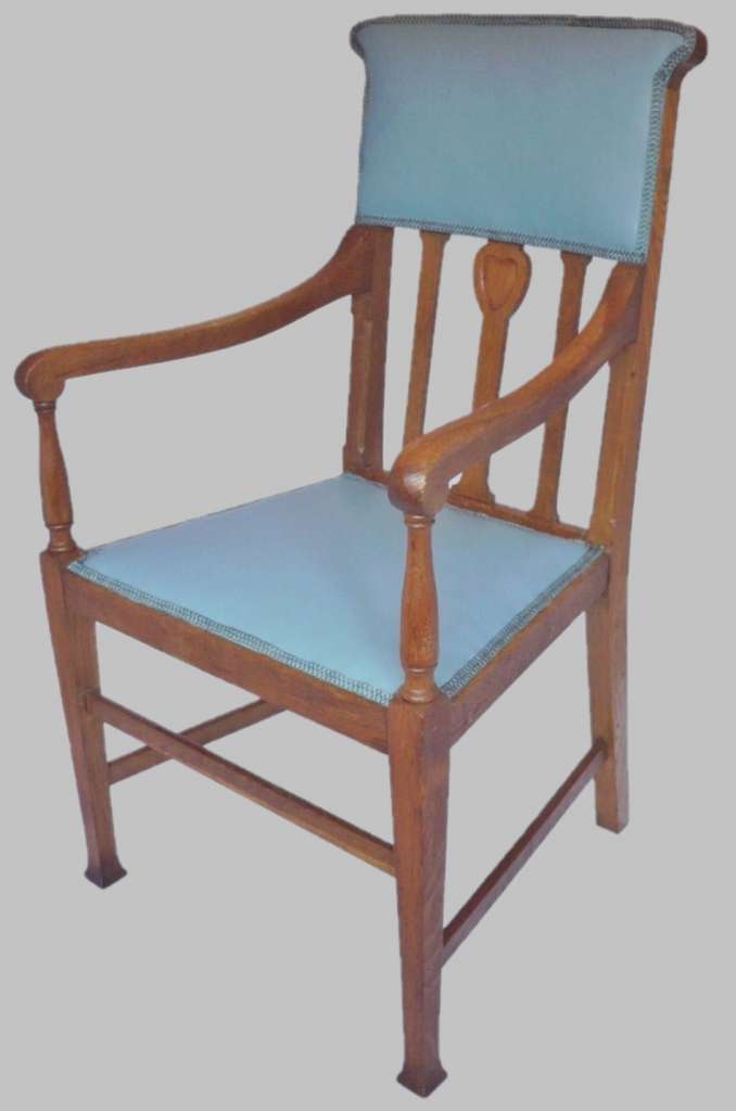 Arts and crafts armchair with carved heart decoration