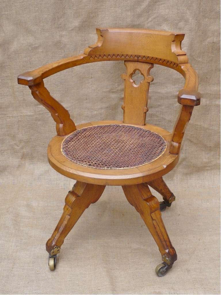 Gothic revival swivel desk chair in pale oak Art Furniture