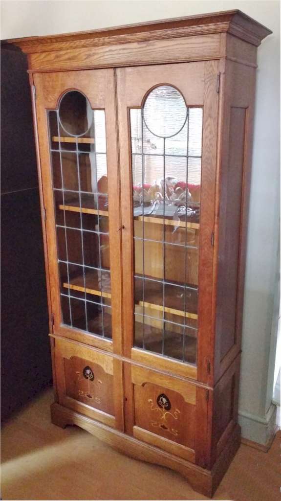 Arts and crafts bookcase , stylised pewter inlay