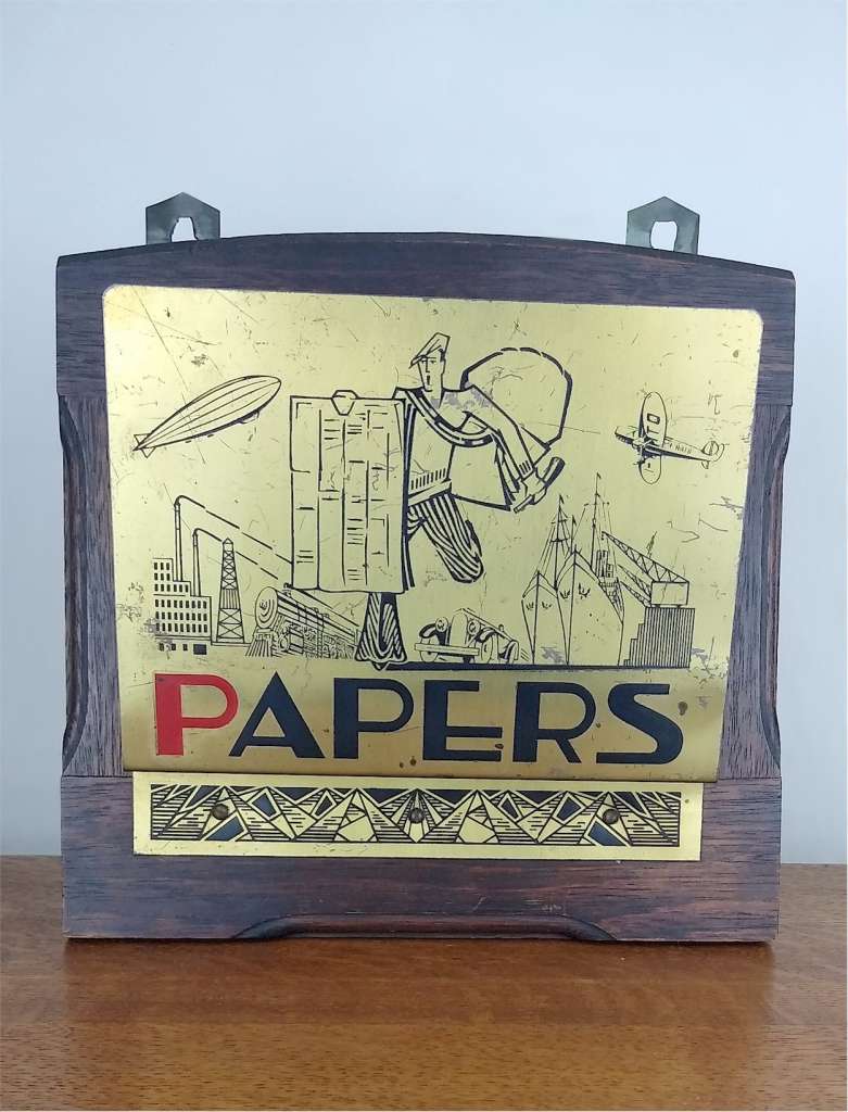 Jazz age newspaper in brass and oak