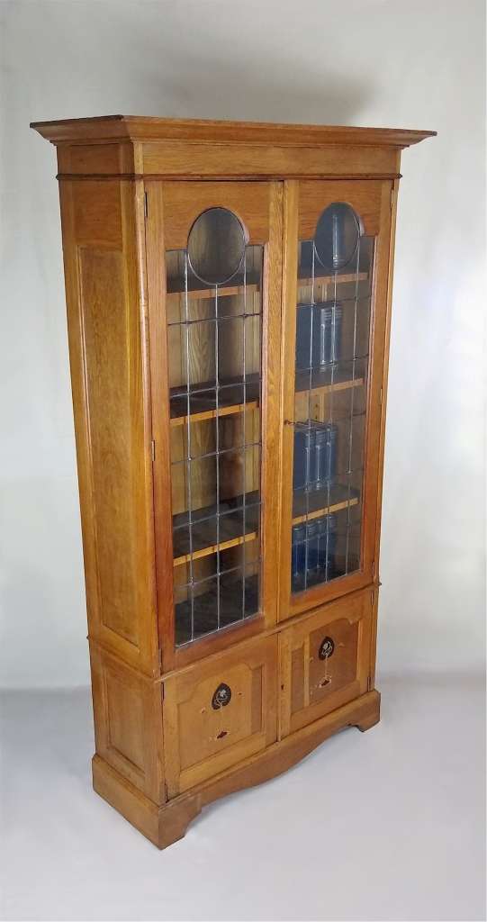 Inlaid and leaded arts and crafts bookcase