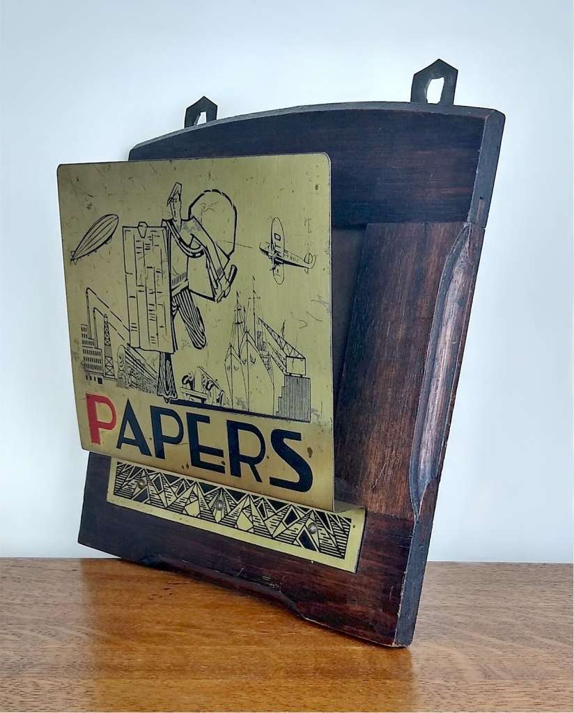 Jazz age newspaper in brass and oak