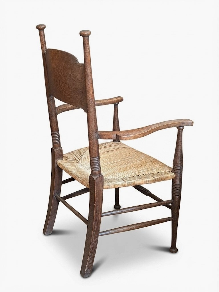 Arts and crafts elbow chair in oak William Birch