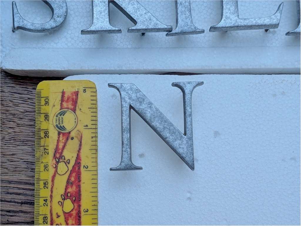 Solid aluminium letters with brass threaded fixings