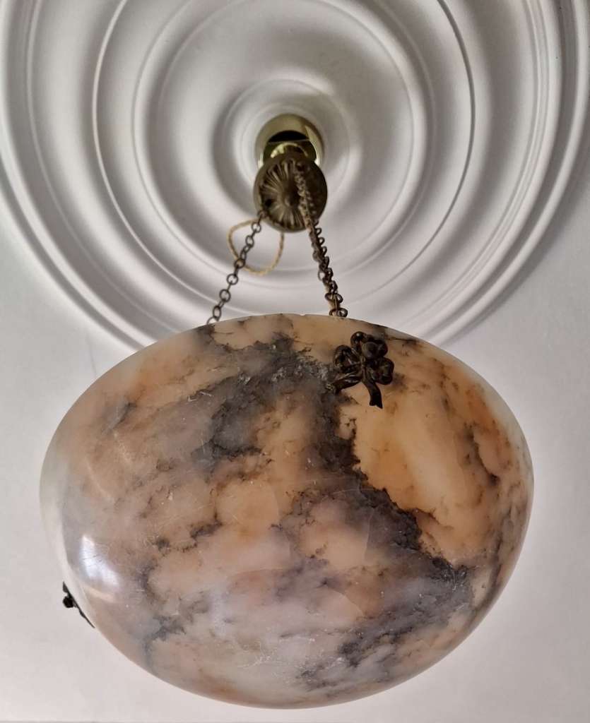 Alabaster ceiling shade with pinkish grain.