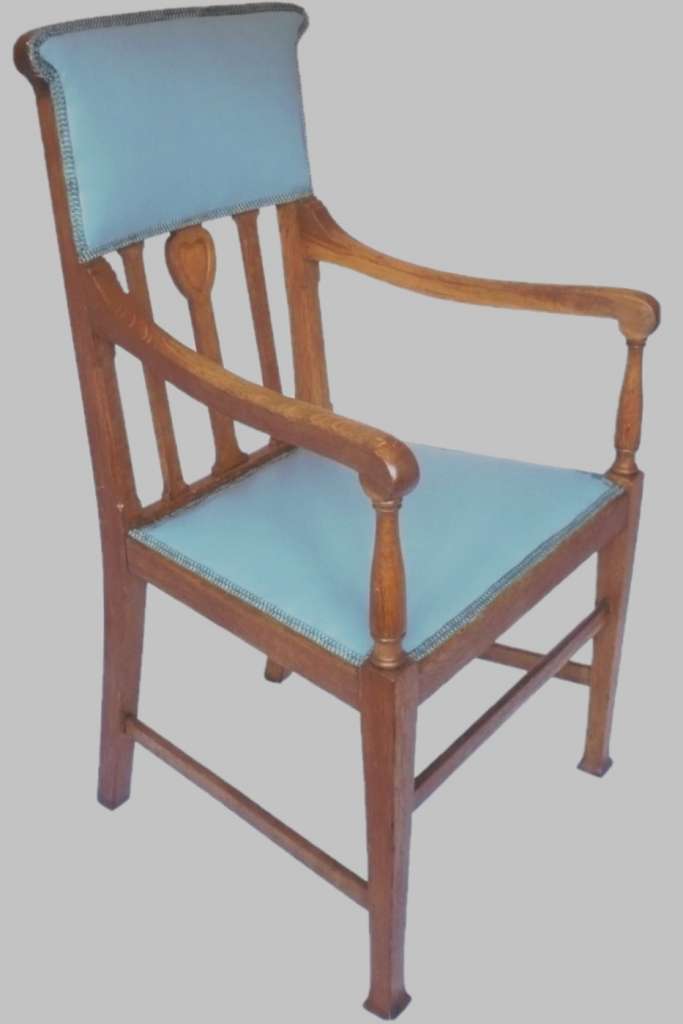 Arts and crafts armchair with carved heart decoration
