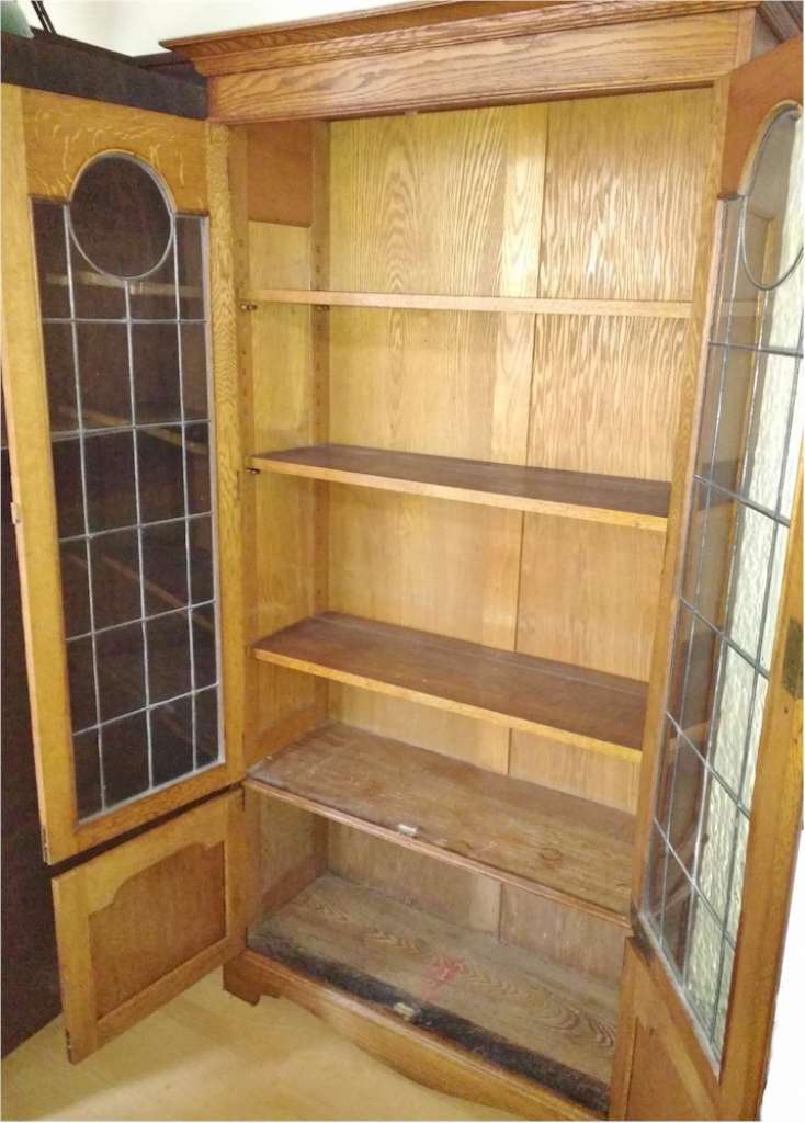 Arts and crafts bookcase , stylised pewter inlay