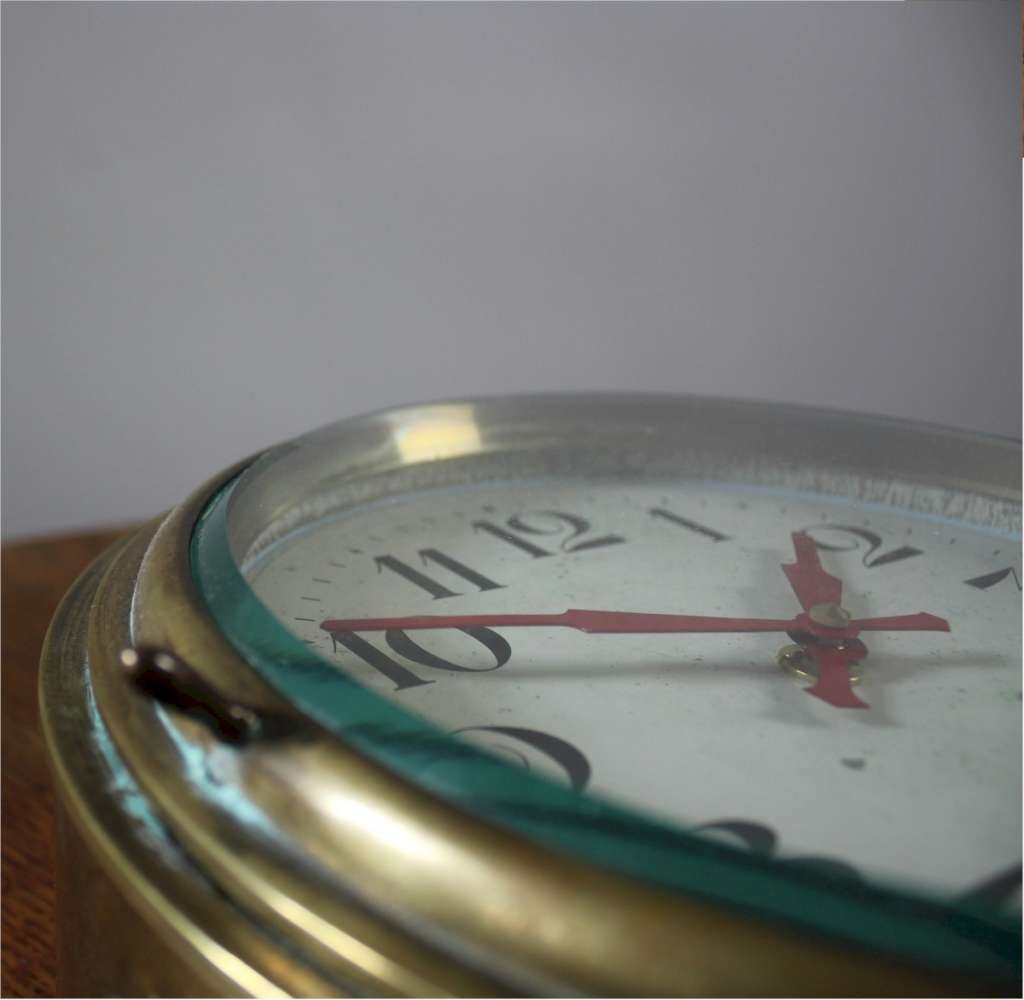 Antique brass Ships clock with  Arabic numerals