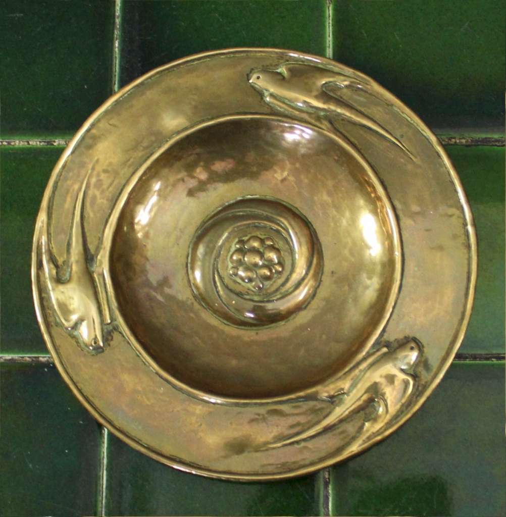 Arts and crafts brass dish with swallows