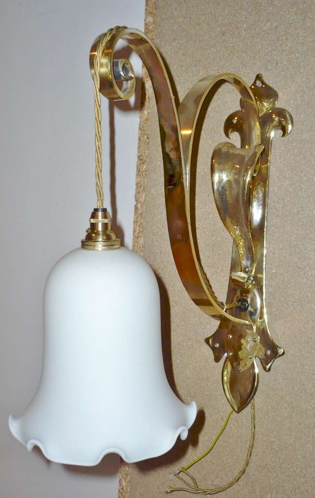 Impressive arts and crafts wall light in brass