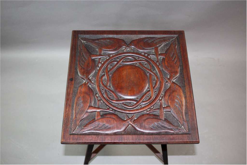 Arts and crafts table with carved birds c1900