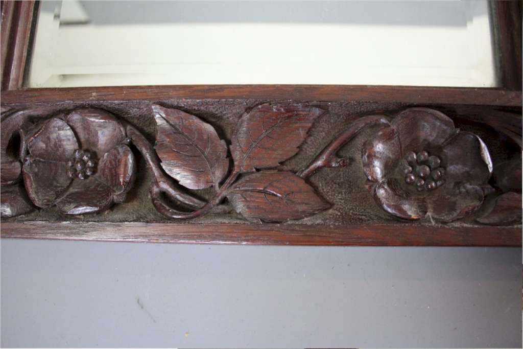 Arts and crafts period carved mirror