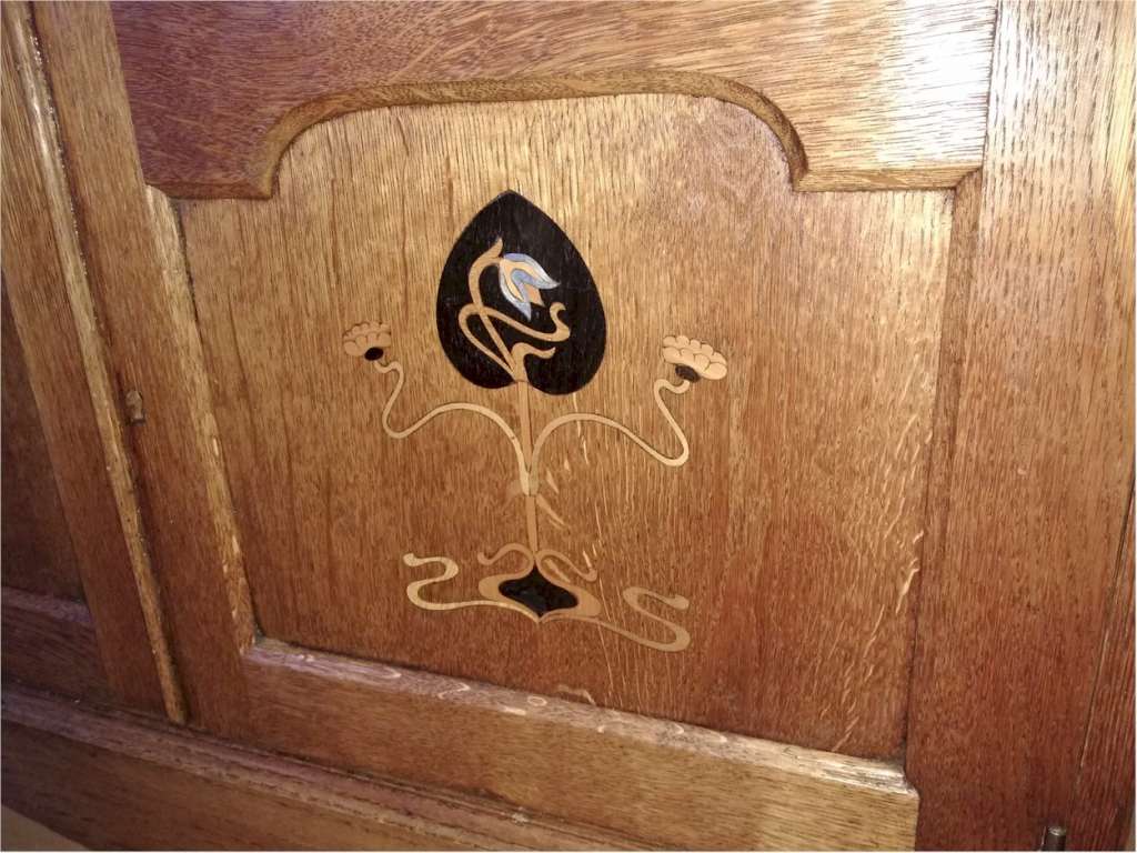 Arts and crafts bookcase , stylised pewter inlay