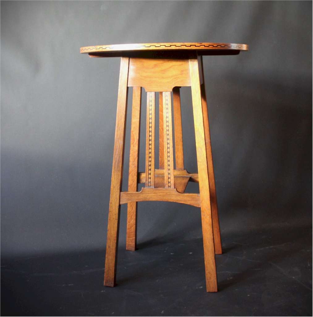 Circular Arts and Crafts side table by Ambrose Heal