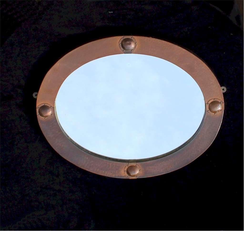 Arts and Crafts oval copper mirror.