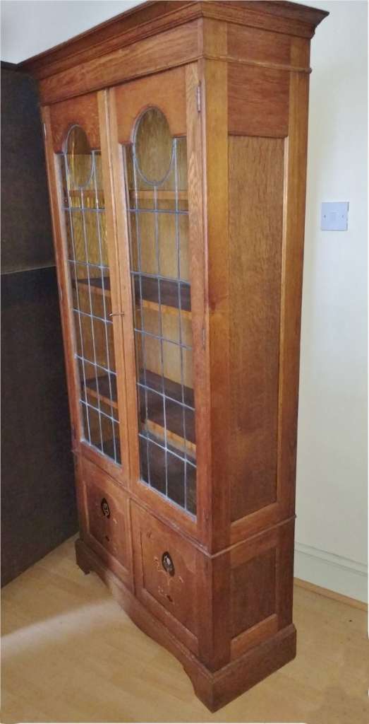 Arts and crafts bookcase , stylised pewter inlay