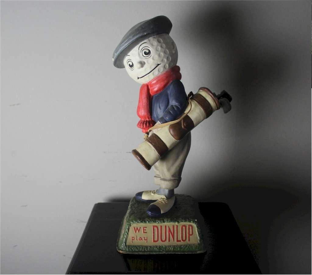 A Dunlop caddy papier-mache golf ball advertising figure