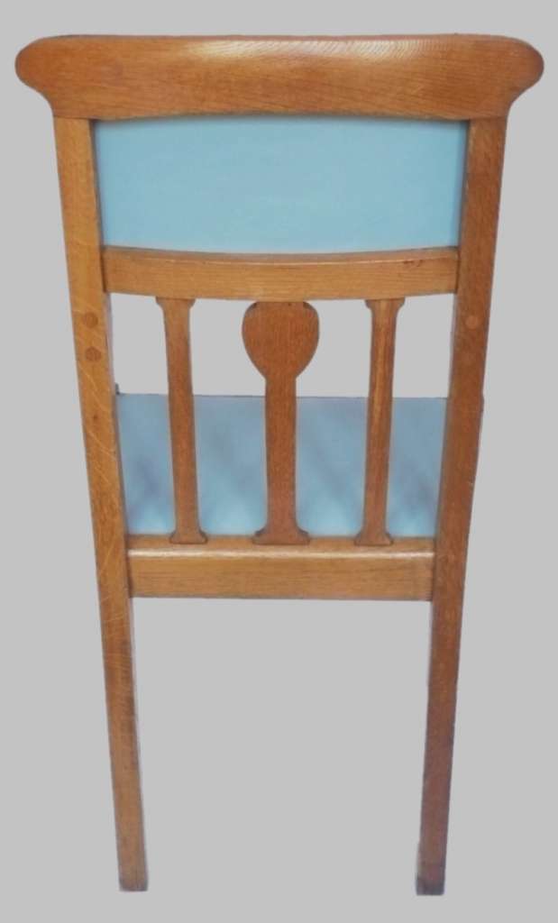 Arts and crafts armchair with carved heart decoration