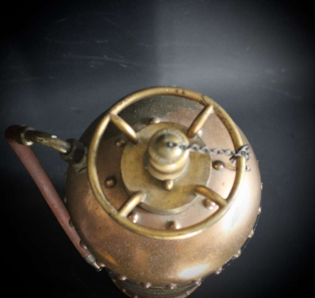 Vintage British copper fire extinguisher.