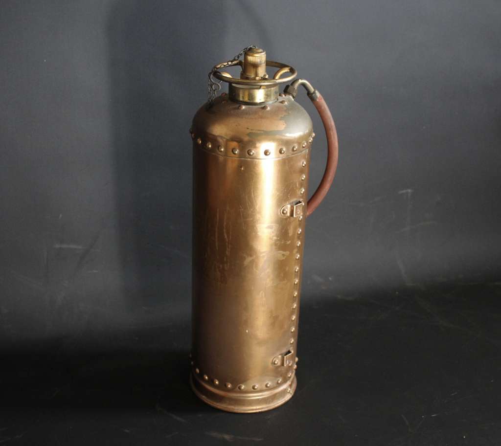 Vintage British copper fire extinguisher.