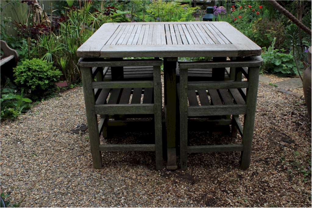 Weathered teak garden set retailed through Heals Art Furniture