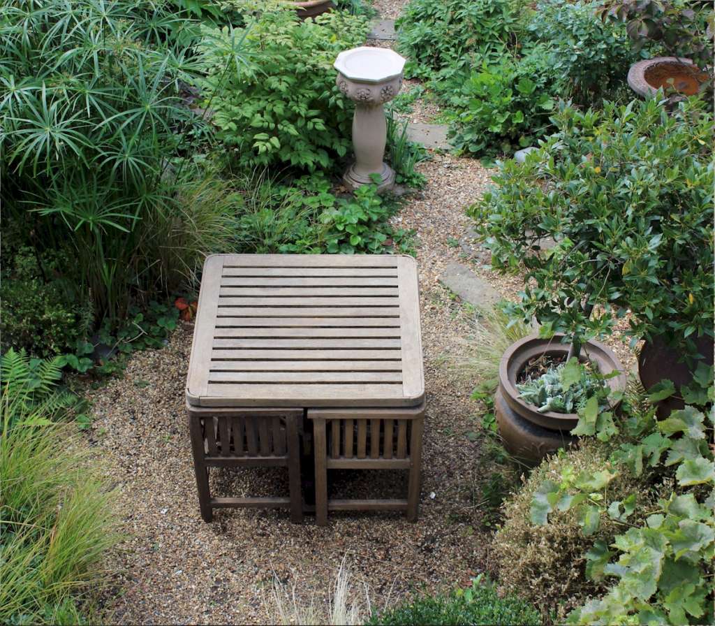 Heals teak garden table and four chairs. c1930 Art Furniture