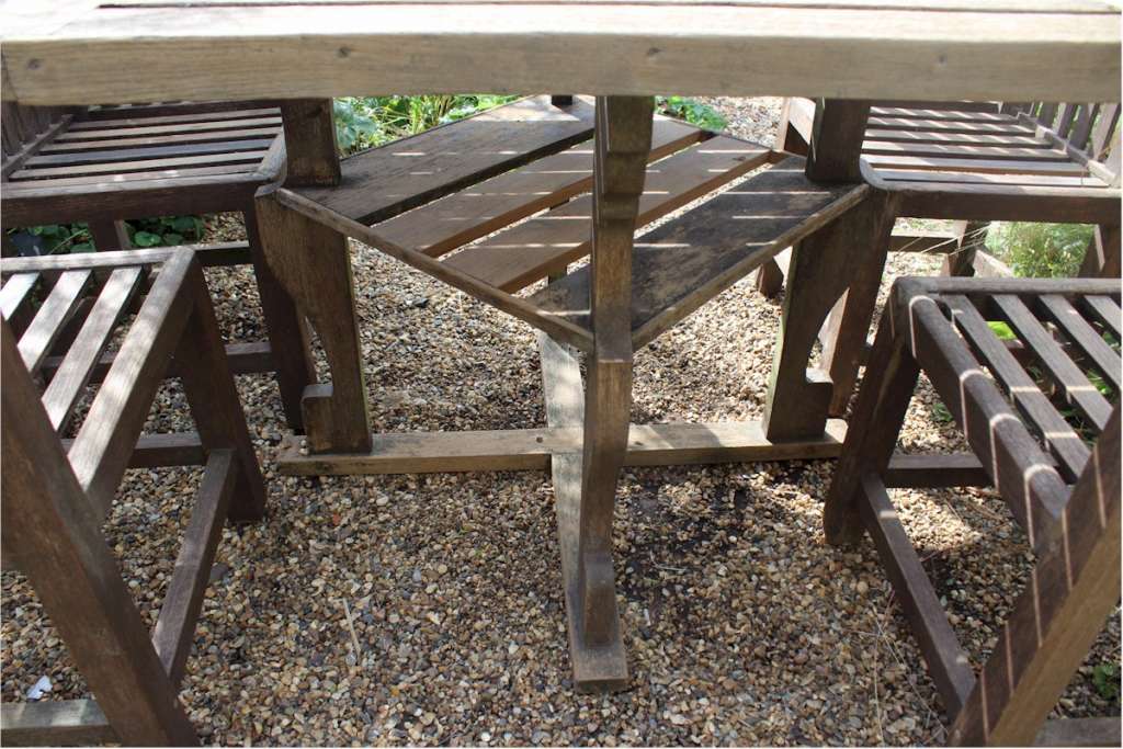 Heals teak garden table and four chairs. c1930 Art Furniture