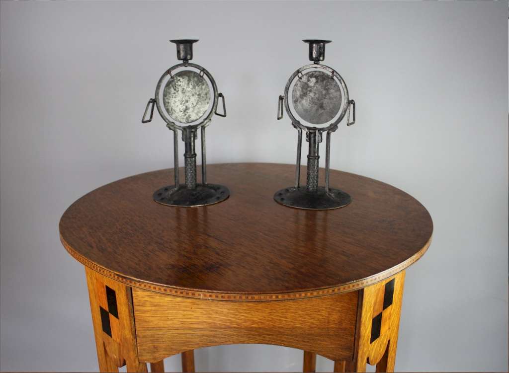 Rare pair of arts and crafts candlesticks by Goberg
