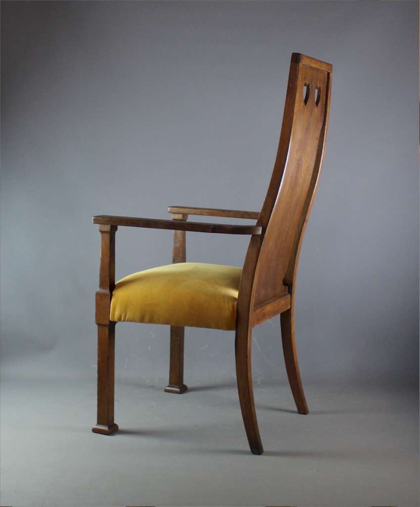 Arts and crafts oak carver chair by Goodyers.