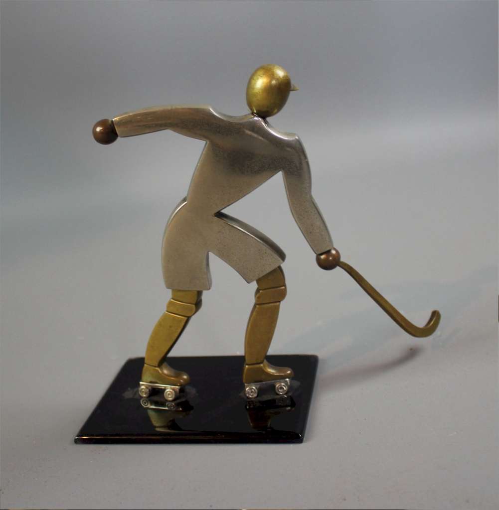 Art Deco brass figure of an ice hockey player