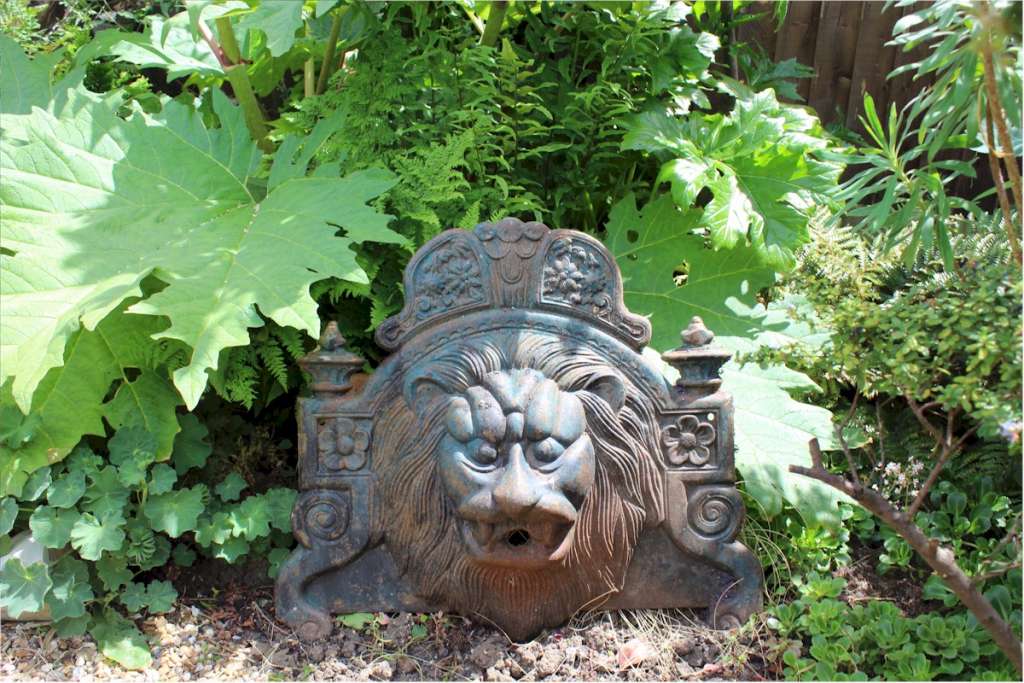 antique cast Iron Lions fountain head.