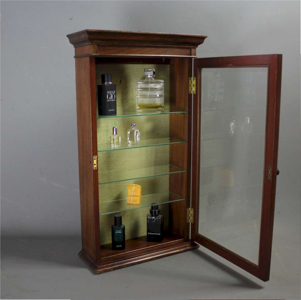 Mahogany perfume shop display cabinet.