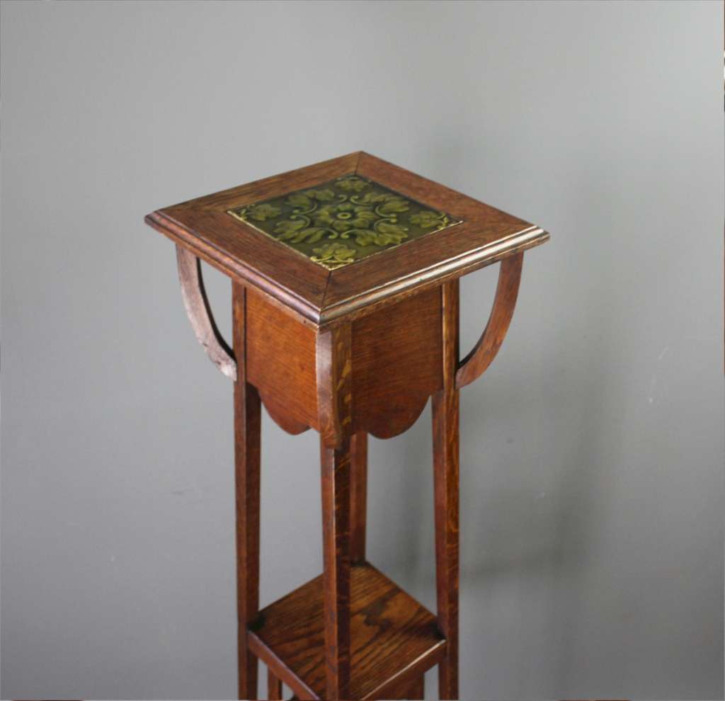 Art Nouveau oak planter with inset green tile