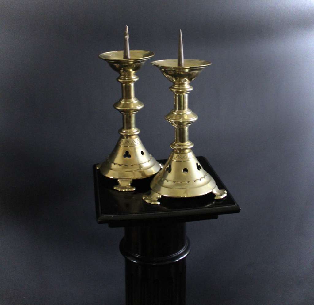 A Pair of Gothic Brass candlesticks