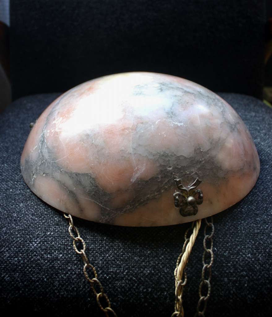 Alabaster ceiling shade with pinkish grain.