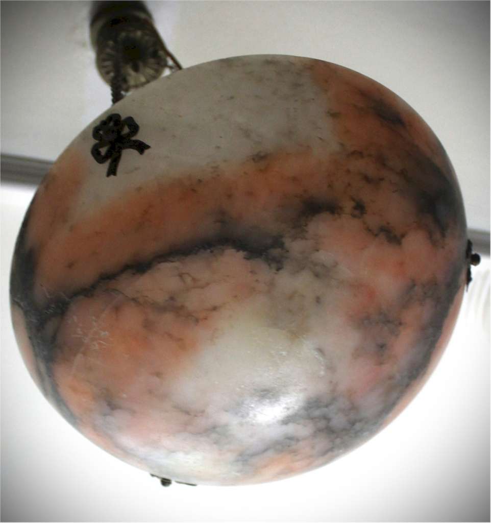 Alabaster ceiling shade with pinkish grain.