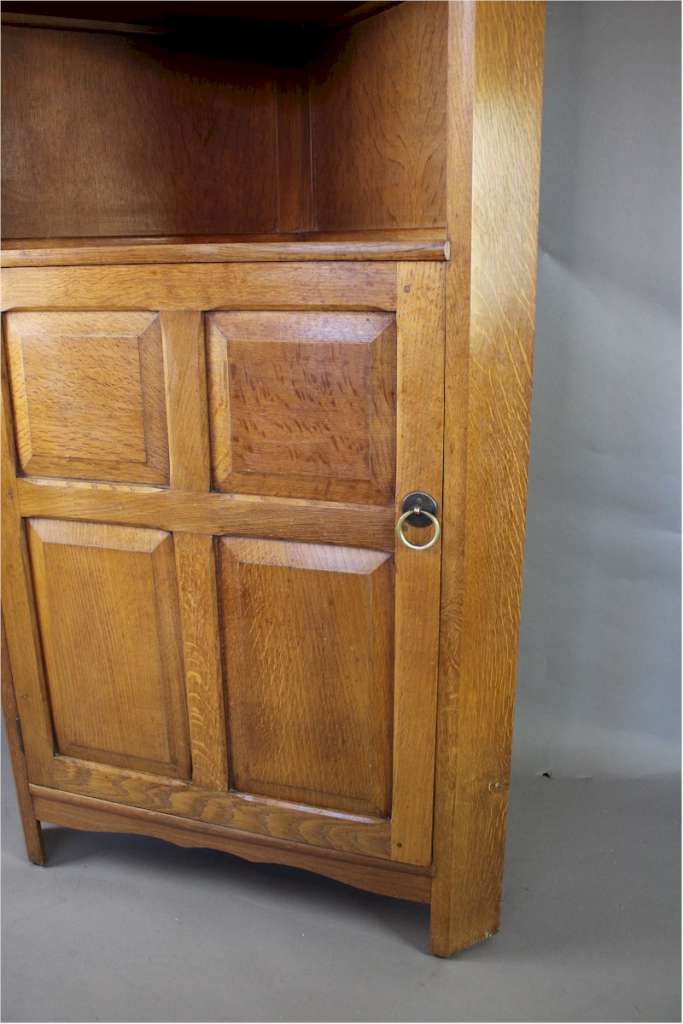 Arts and Crafts corner cupboard by Reynolds in golden oak Art Furniture