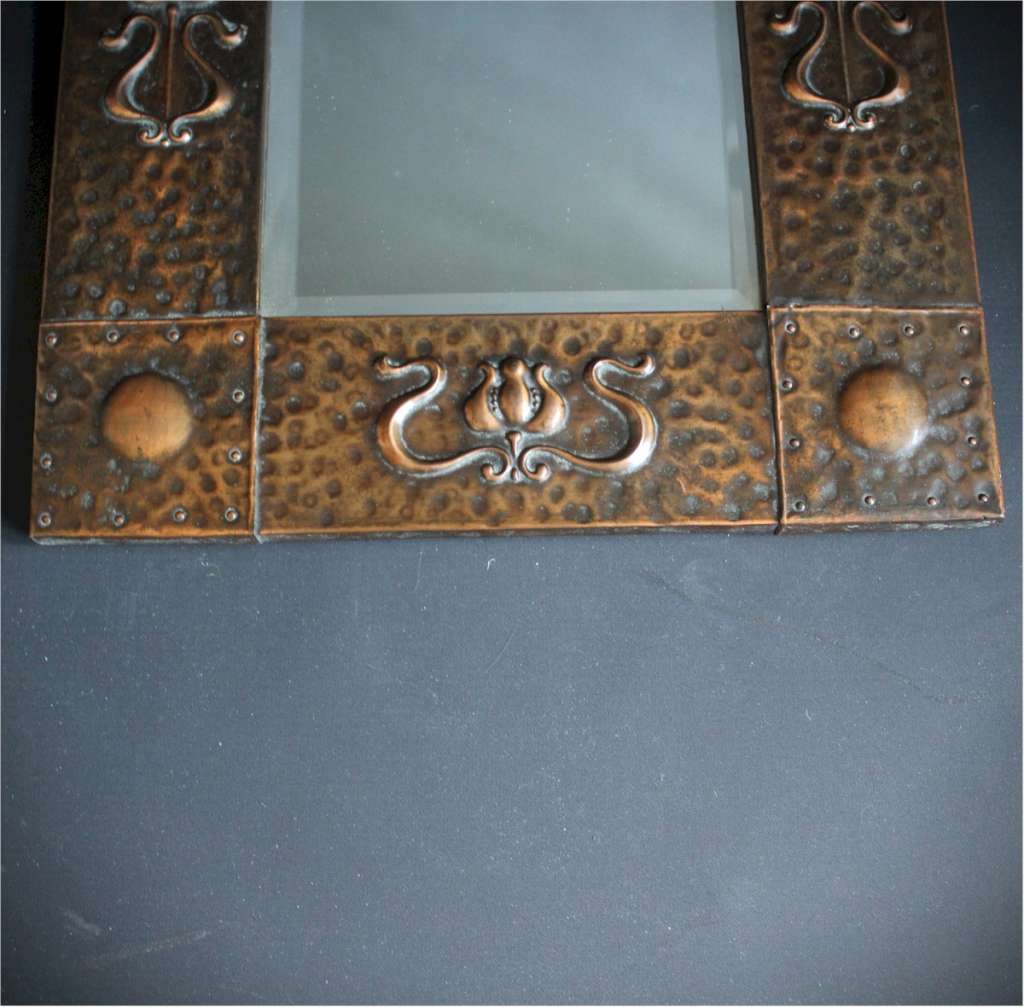 Small arts and crafts wall mirror in copper