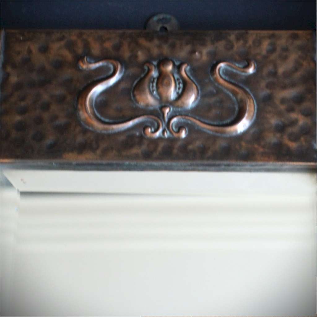 Small arts and crafts wall mirror in copper