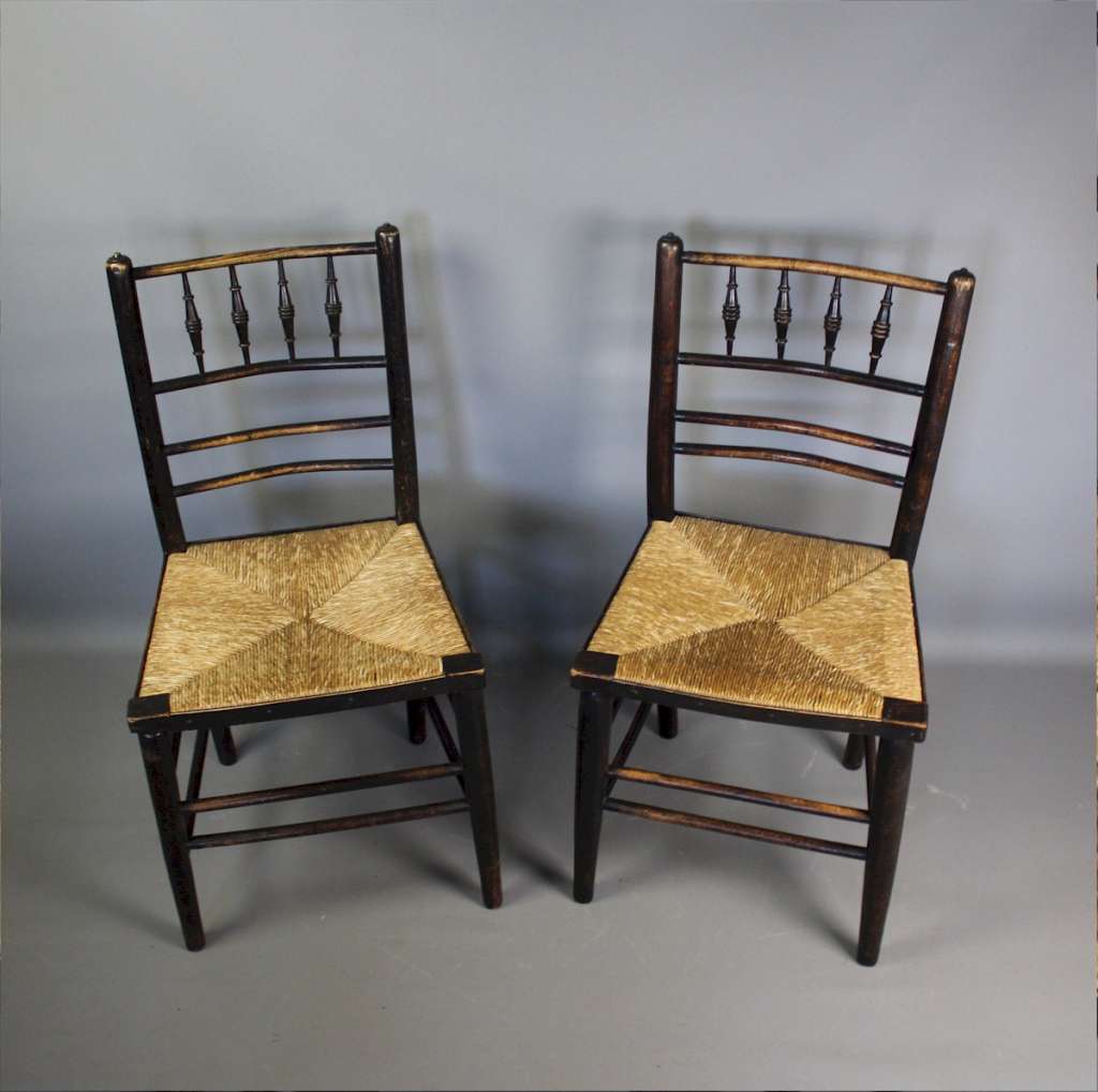 Sussex chairs a near pair by Morris & Co